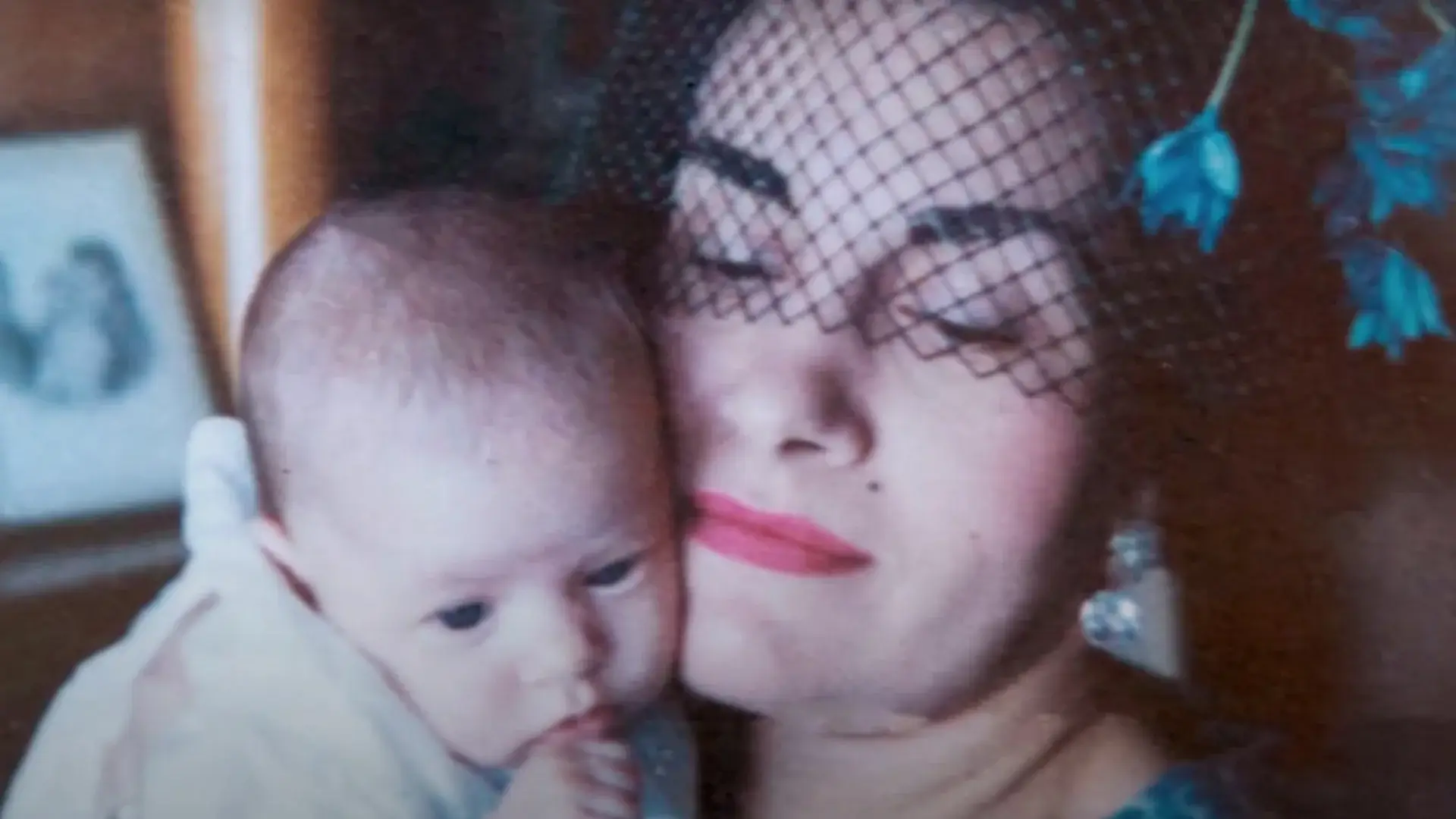 Woman in veil holding a baby