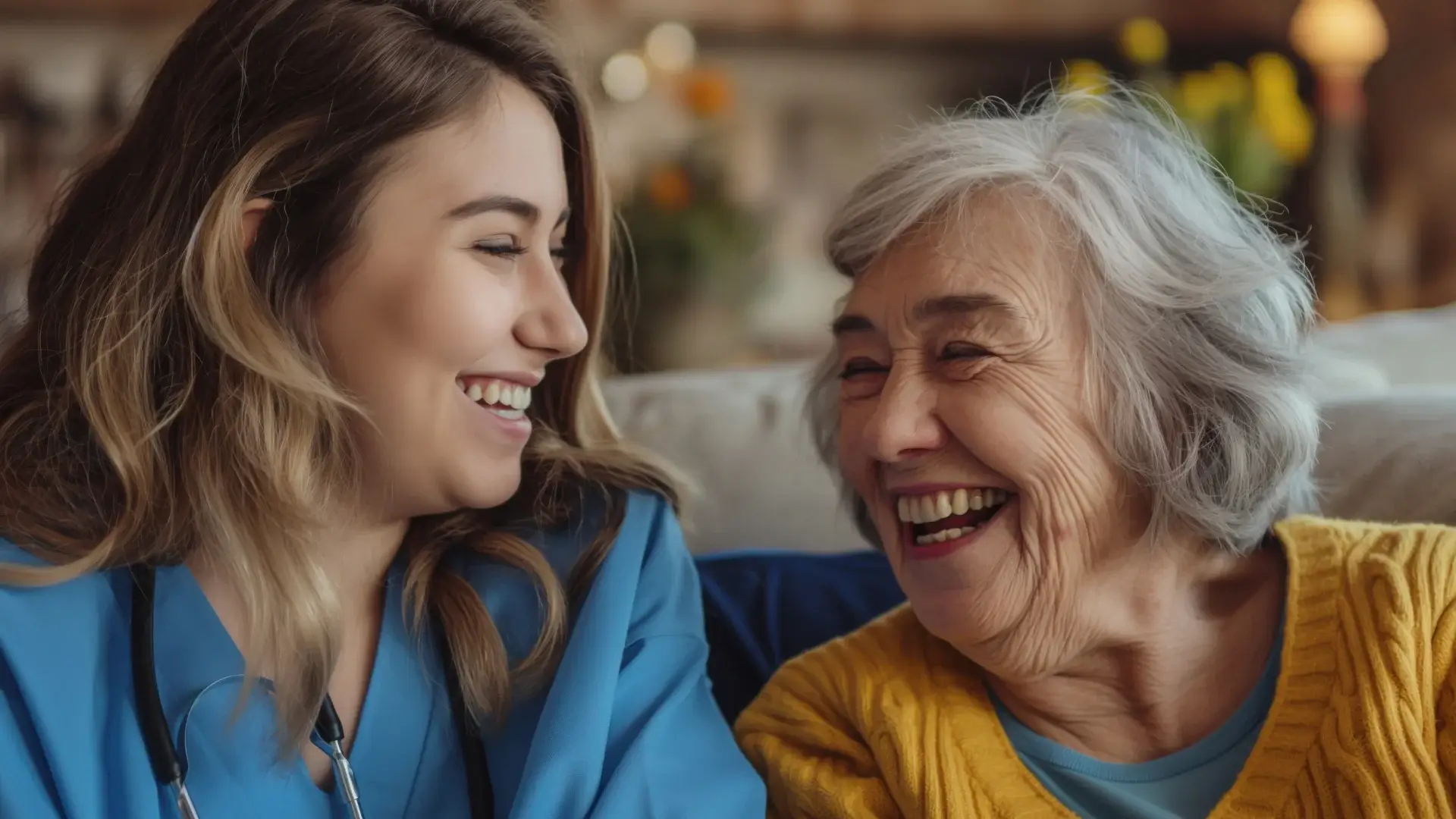 Nurse and senior woman laughing together